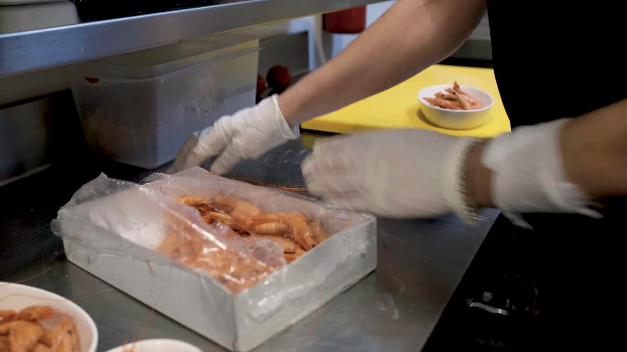 Preparing shrimp in a kitchen