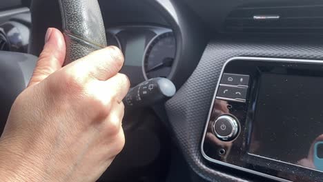 close-up, vehicle driver controlling switches, equipment, buttons, slow-mo