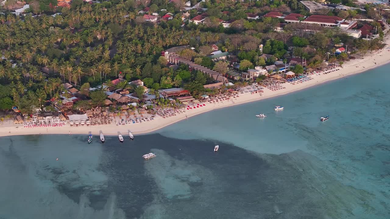Beachfront of Gili Air with seats and beach bars for watching sunset. Indonesia travel