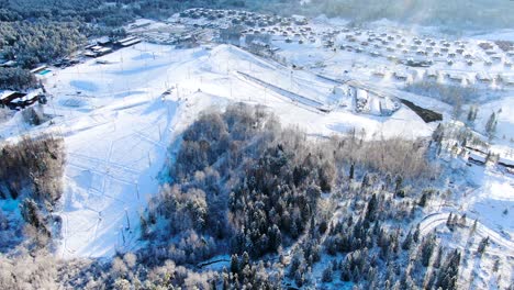 aerial view of a snowy ski resort and village