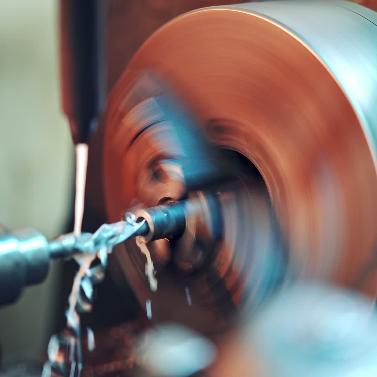 Close-up process of cutting metal in lathe machine in the factory. Lathe grinding machine metalworking industry concept