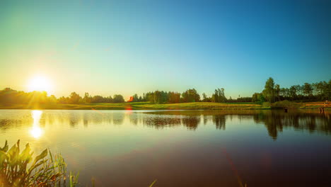 Golden-sunrise-over-a-lake-landscape.-Timelapse-shot