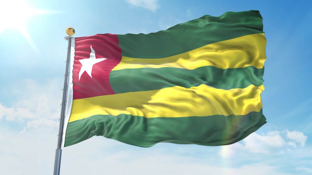 bandera de togo ondeando en el viento contra el cielo azul profundo. tema nacional, concepto internacional. render 3d bucle sin costuras 4k