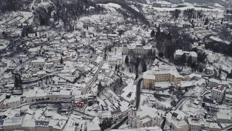wide aerial shot of a mining town banska stiavnica in winter covered by snow