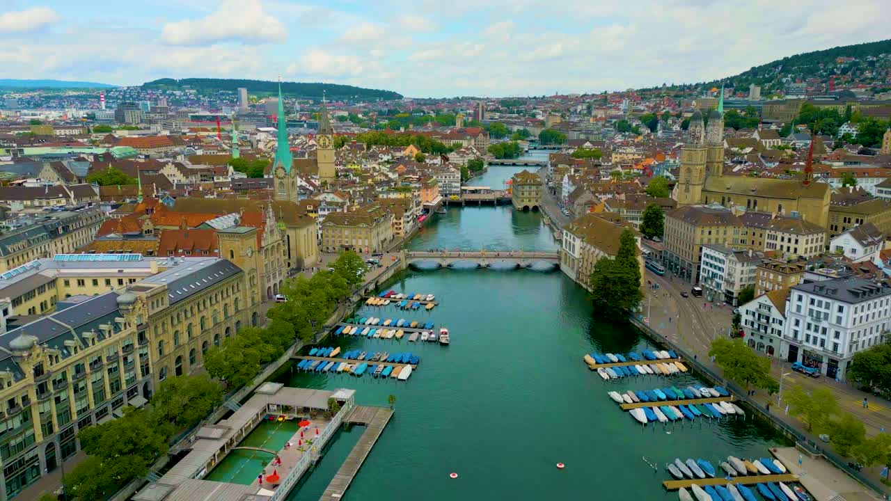 4K Drone Video of the Münsterbrücke and Rathausbrücke Bridges over the Limmat River in Downtown Zurich, Switzerland