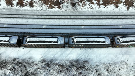 Train-cars-filled-with-coal-from-mine-travel-on-railroad-track