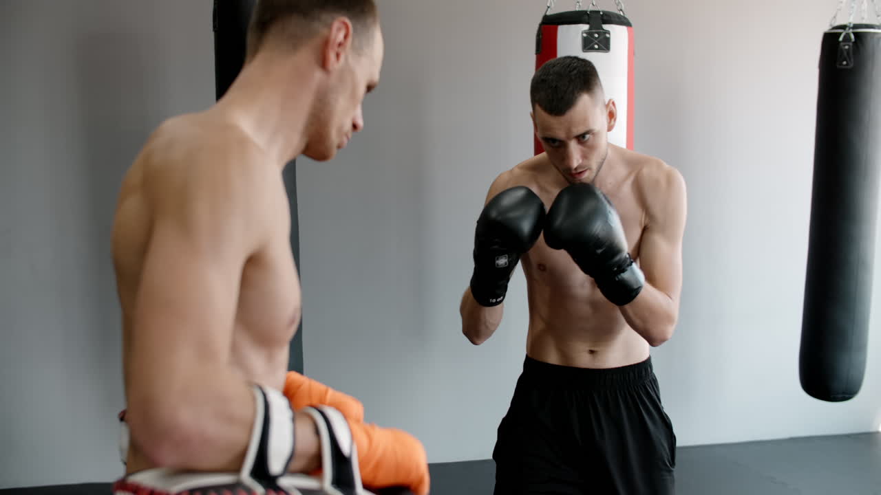 Men Practicing Kickboxing and Boxing