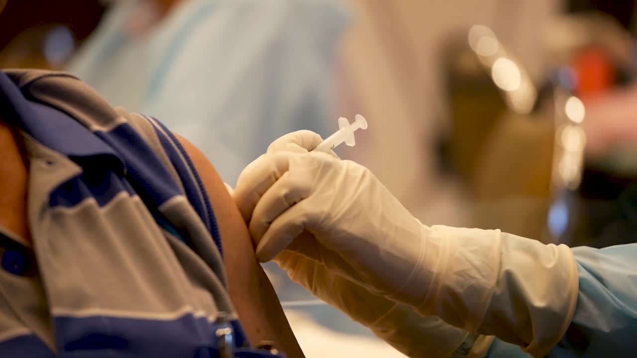 Close Up Footage of Nurse Giving COVID-19 Vaccine Shot To The Patient