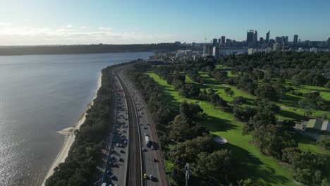 aerial view of traffic on state route 2 near the coastline of the city of perth in australia