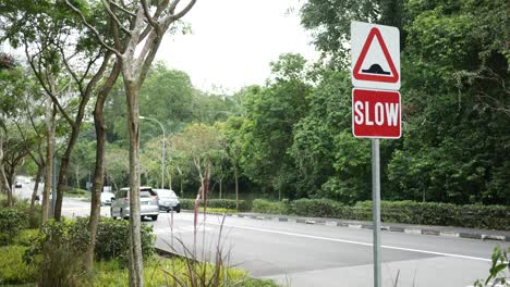 Slow-down-sign-on-street-in-singapore
