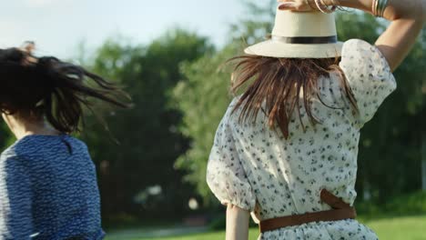 Video-of-two-happy-friends-jumping-and-laughing-outside