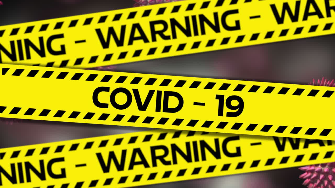 Animation of the words Covid-19 and Warning written on tape