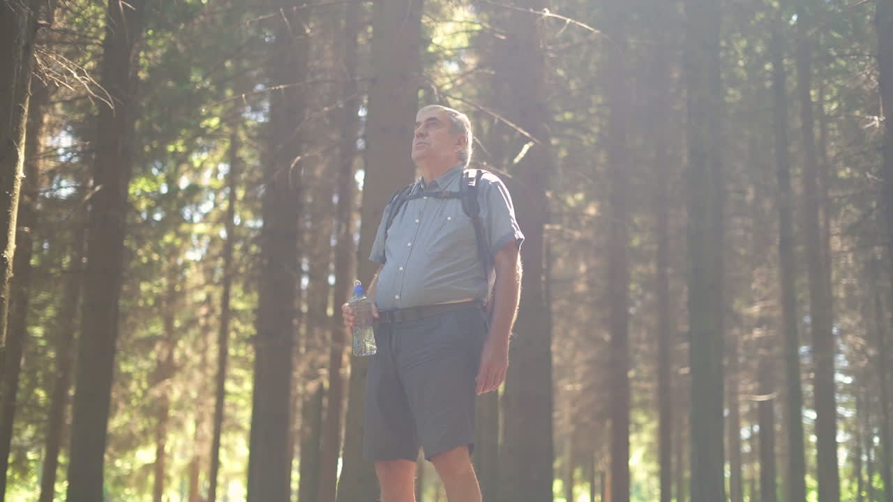 Man in the forest with water