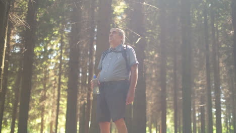man in the forest with water