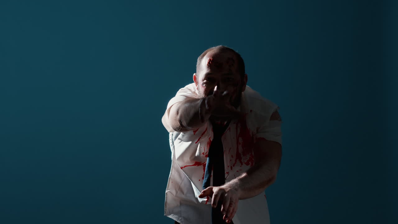 Growling spooky zombie prowling at camera on blue background