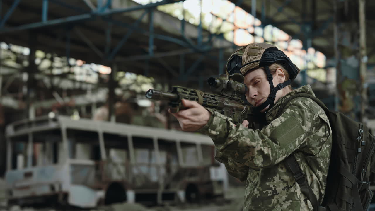 Woman Soldier with Rifle in Abandoned Factory