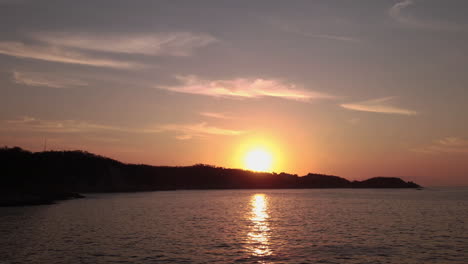 timelapse by drone in rising sun at the beach.