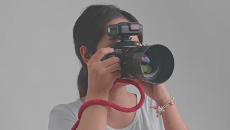 woman taking a photo with a dslr camera