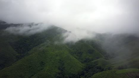 Logistic-concept-aerial-view-of-countryside-road-passing-through-the-serene-lush-greenery-and-foliage-tropical-rain-forest-mountain-landscape