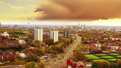 Liverpool,-England---Slow-Aerial-Flyover-Football-Pitches-Towards-City