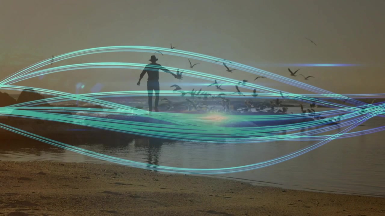 Man walking shore at dawn raising arm with aqua lights weaving seabirds flying, showing technology
