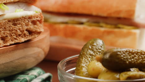 close-up of sandwiches and pickles
