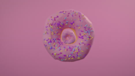 pink glaze donuts on a pink background