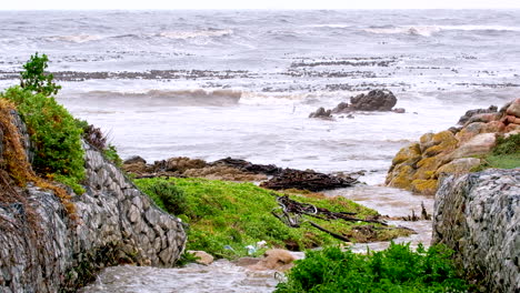 rainwater runoff via gabion ditch after extreme stormy weather into sea