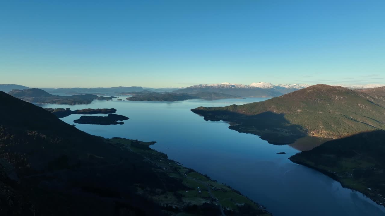 Mountain aerial at sunset in western Norway with views of Bjoa Fjord, Skanevik Fjord, and islands