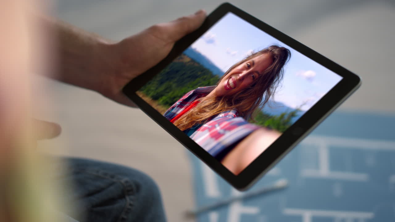 Woman on Tablet in Mountain Selfie