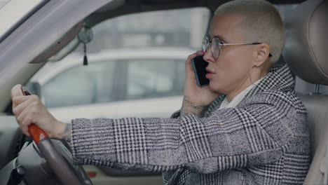 woman driving and having a phone conversation