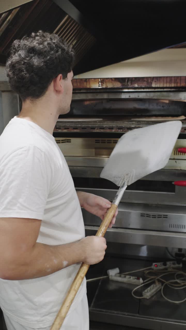 Baker using oven