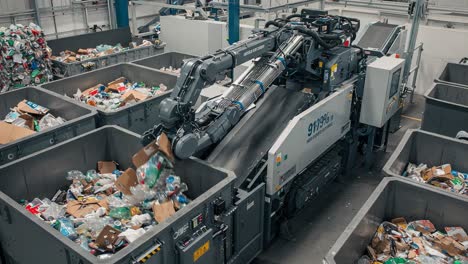 innovative waste management technology in action: advanced machinery sorting and processing recyclables in a modern facility