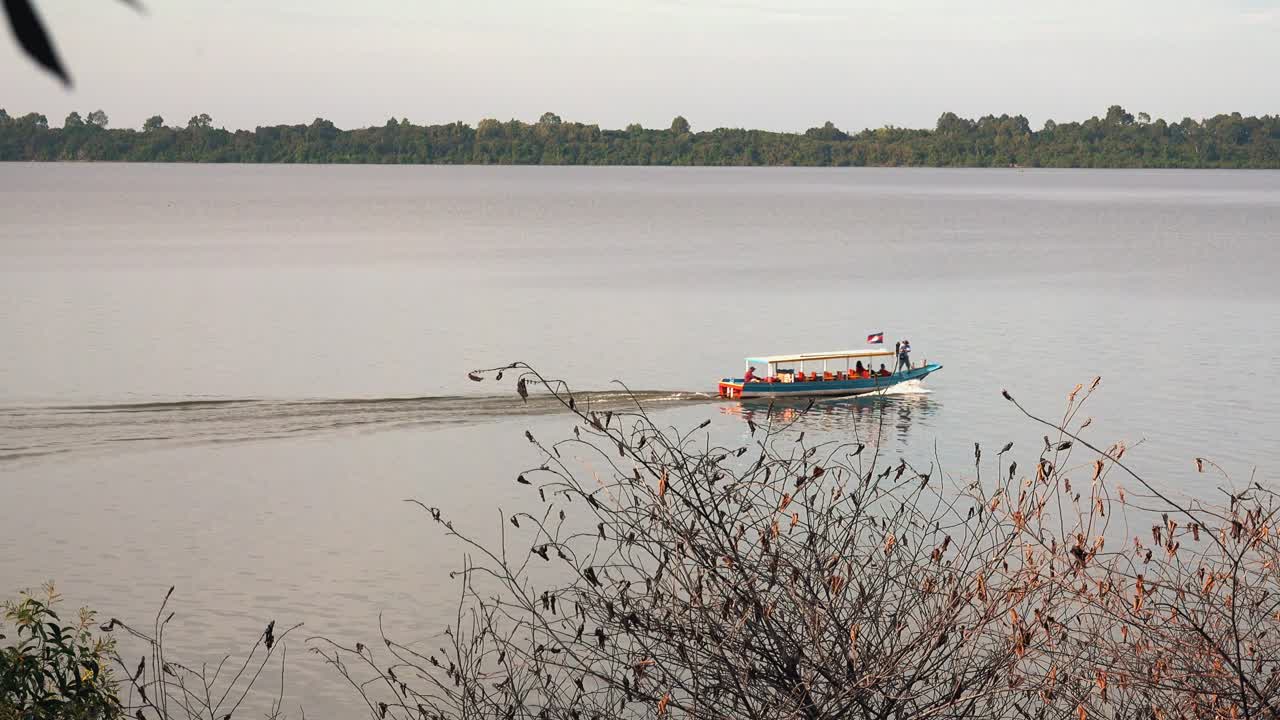 Boat on the Lake Passing By on a Cloudy Day