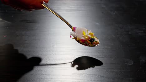 spoon spreads plastic debris on table, symbolizing microplastic contamination, health risks, and environmental harm