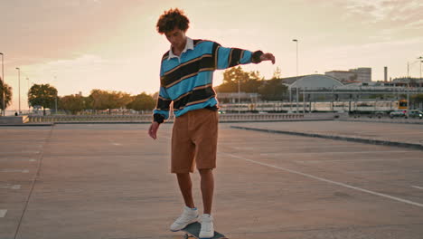 Active-skateboarder-making-trick-on-board-at-street.-Man-rolling-skate-vertical