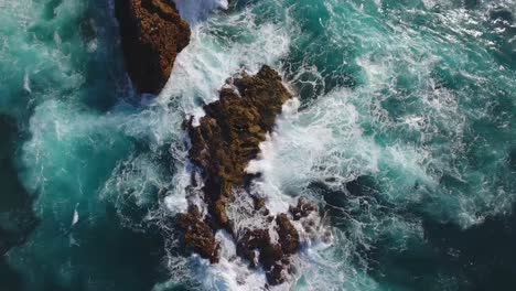 white wash on rocky landscape in blue ocean