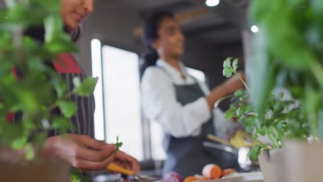 video of happy diverse female friends preparing meal