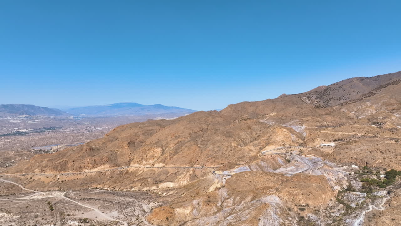 Flight across the dry flanks of Sierra Alhamilla to distant villages, Almeria