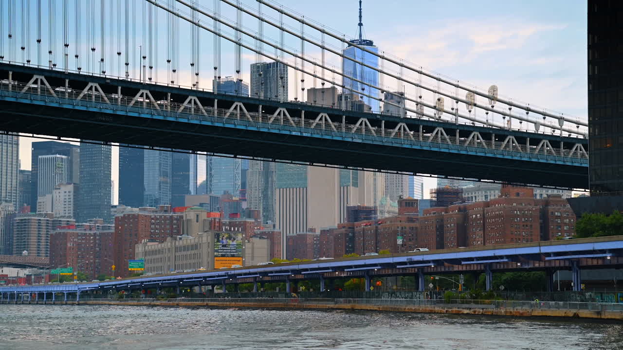 New York, USA, 1 August 2025: Manhattan Bridge with New York skyline view. The Manhattan Bridge spans across the East River with the city skyline in the background