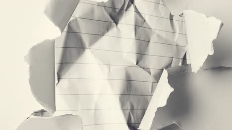 Animation-of-teared-black-and-white-paper-pieces-moving-over-black