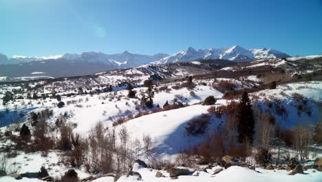 Winter-fresh-snowfall-winter-Rocky-Mountains-Ouray-Telluride-Silverton-14er-Mt-Sneffels-Dallas-Peaks-million-dollar-highway-Southern-Colorado-most-scenic-mountain-landscape-wide-view-cine-pan-left