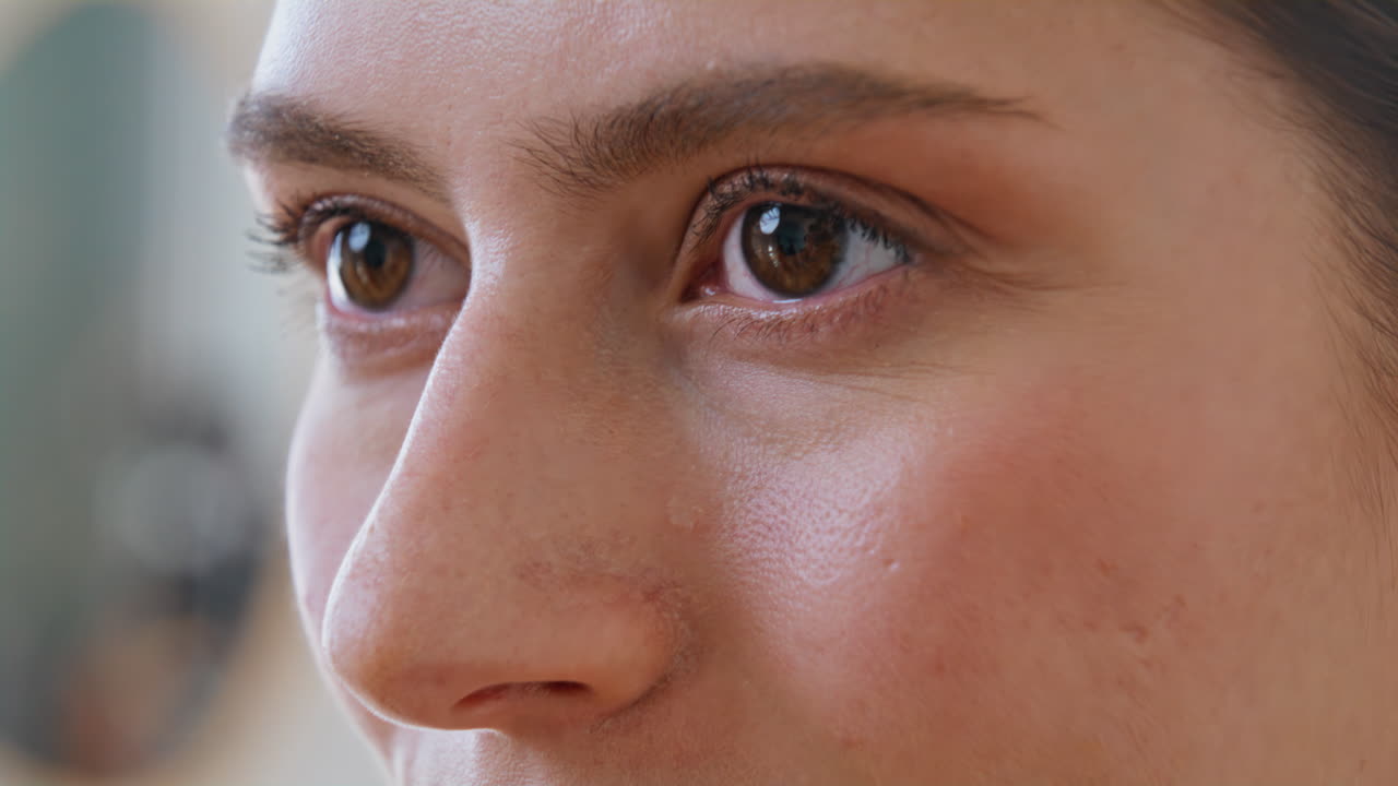 Closeup woman face smiling showing white teeth at home. Portrait lady