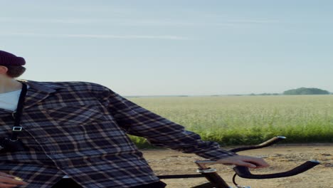 man on a bicycle in a field