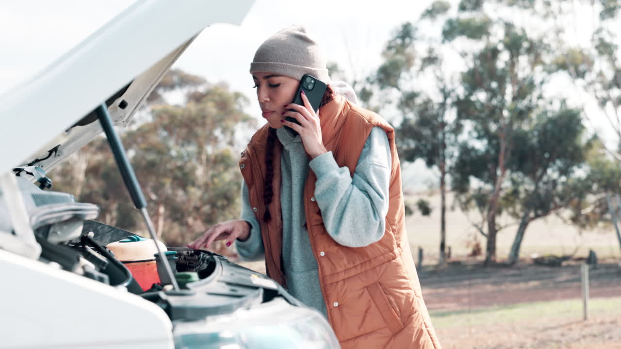 Woman experiencing car trouble calls for help