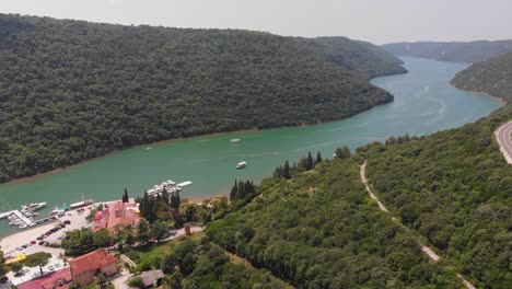 Ascending-and-turning-drone-shot-over-a-marina-in-a-fjord