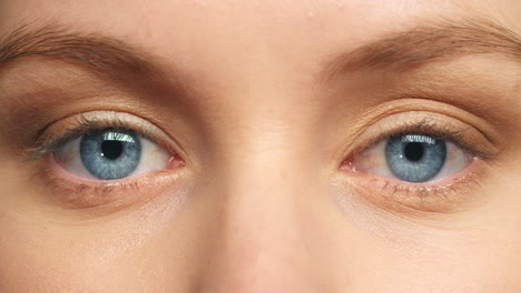 Blue-eyes-woman,-focus-and-vision-in-eye-care