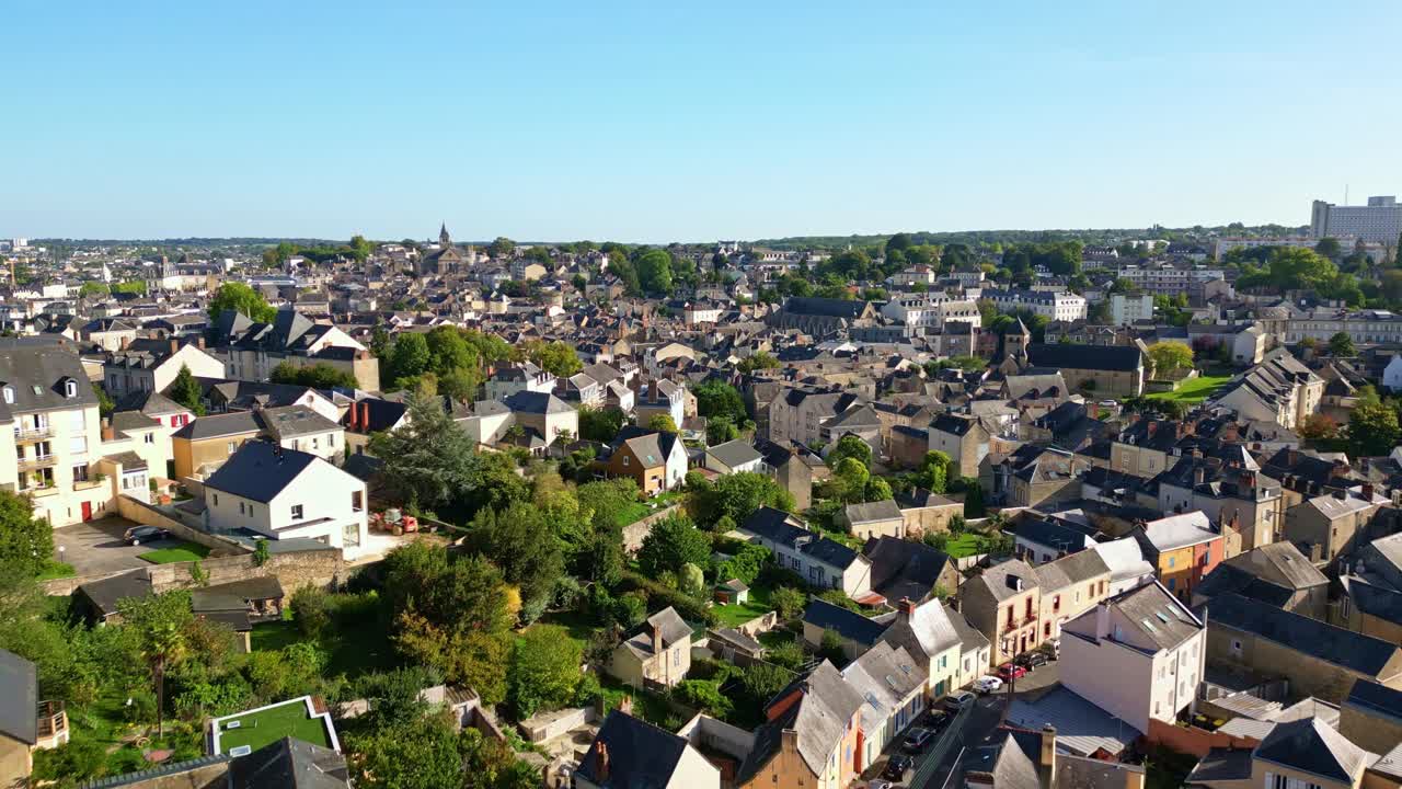 Amazing drone fly in sunny day of urban houses in European Laval town under clear sky, Mayenne, France