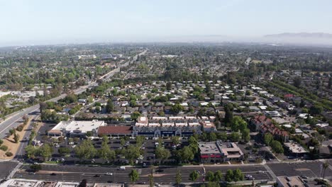 wide reverse aerial pullback shot of tech-centric silicon valley in south bay, california. 4k