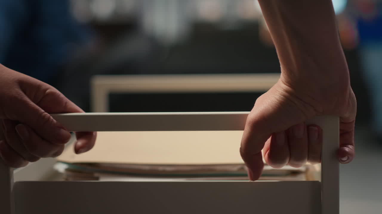 Close up of woman workplace support moves a trolley cart with folders